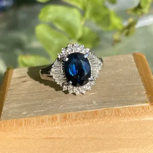 Estate Platinum Oval 2.15 CT Blue Sapphire   Baguette Diamond Halo Ring