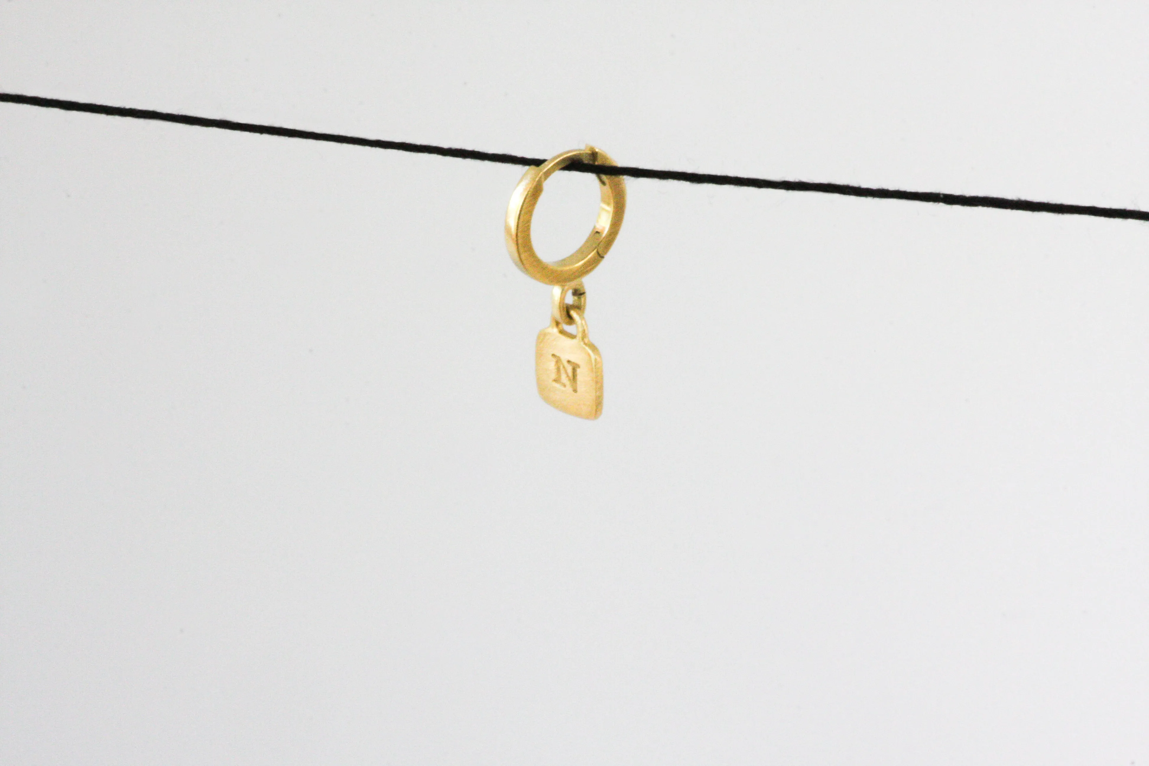 Gold Huggie with engraved letter
