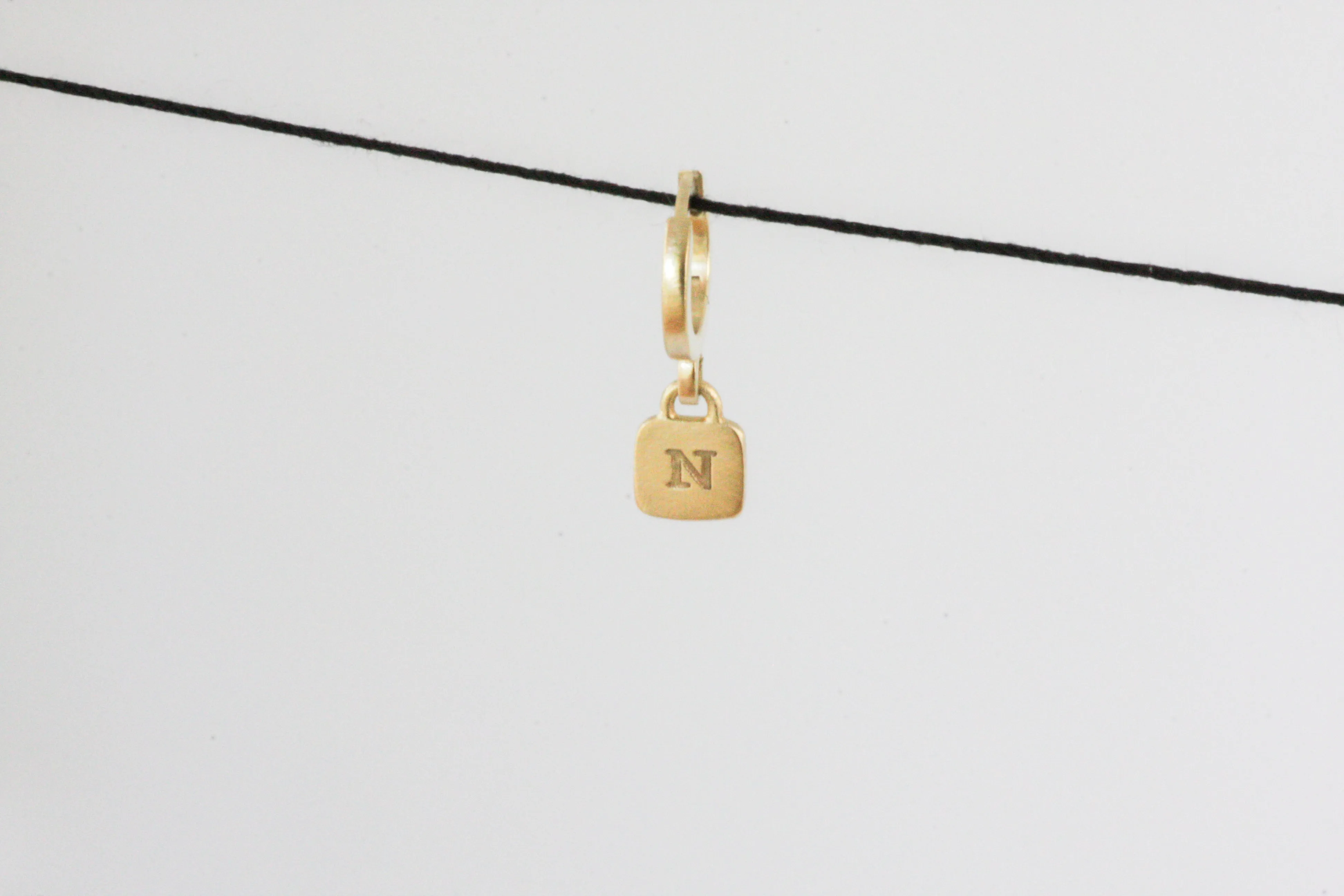 Gold Huggie with engraved letter