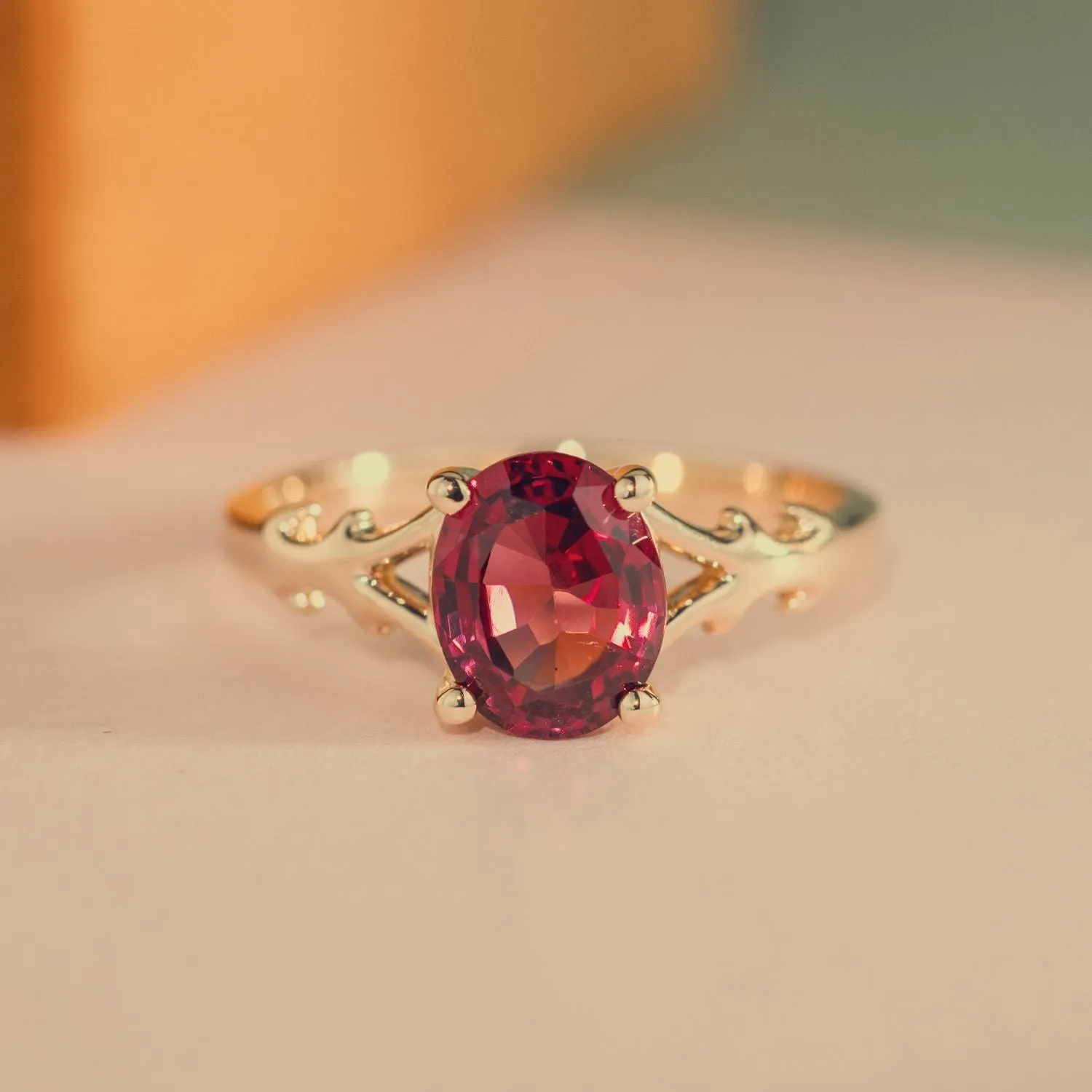 The Dakota - Oval Garnet Rhodolite Solitaire Engagement Ring with Nature-Inspired Split Shank Setting