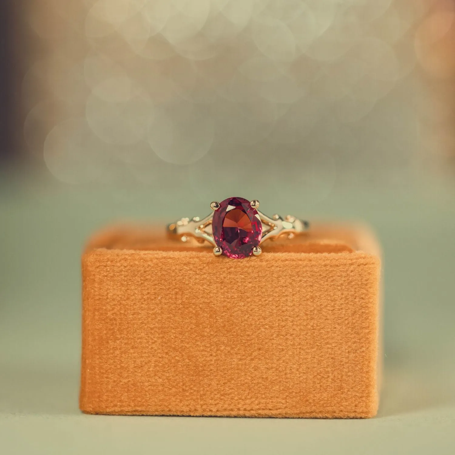 The Dakota - Oval Garnet Rhodolite Solitaire Engagement Ring with Nature-Inspired Split Shank Setting