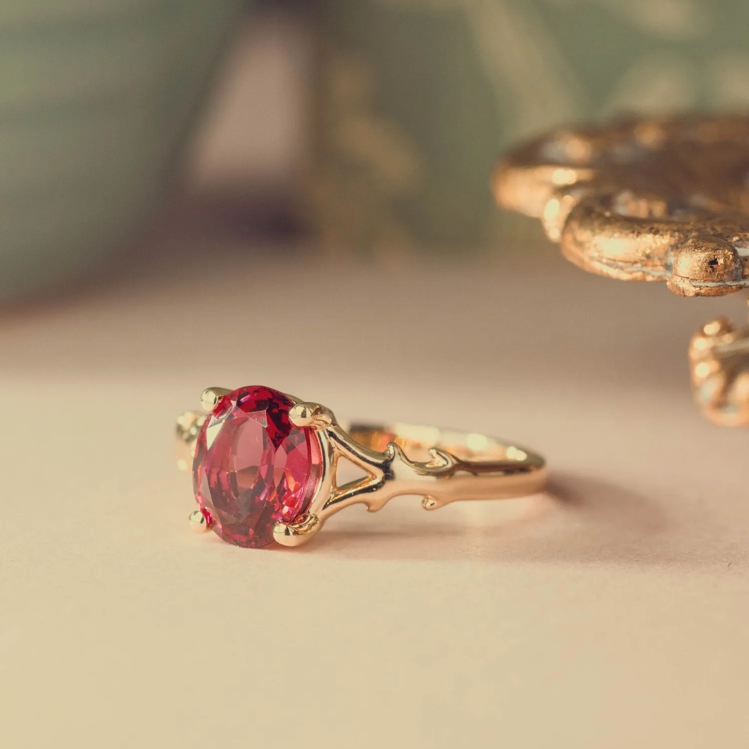 The Dakota - Oval Garnet Rhodolite Solitaire Engagement Ring with Nature-Inspired Split Shank Setting