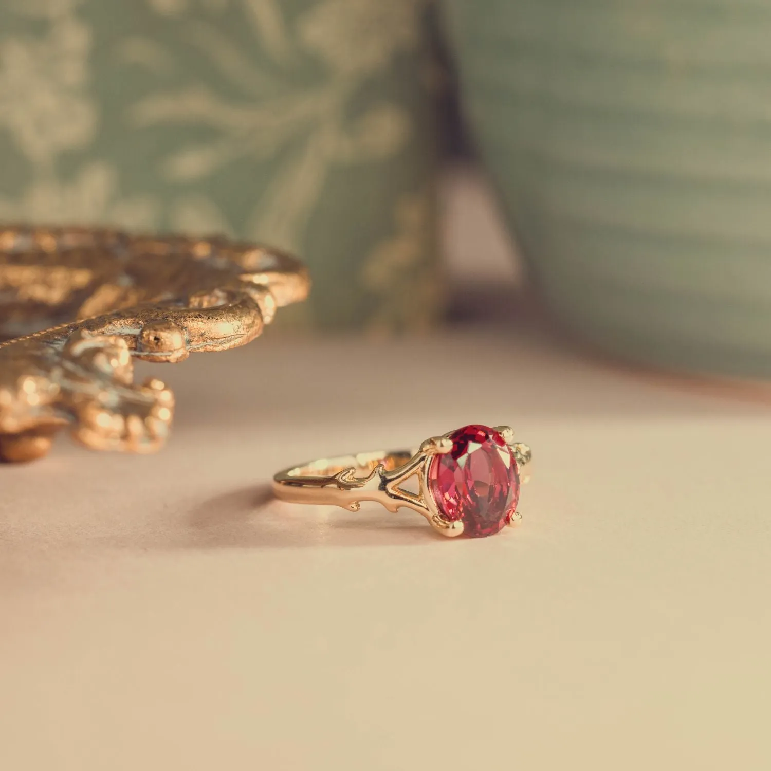 The Dakota - Oval Garnet Rhodolite Solitaire Engagement Ring with Nature-Inspired Split Shank Setting