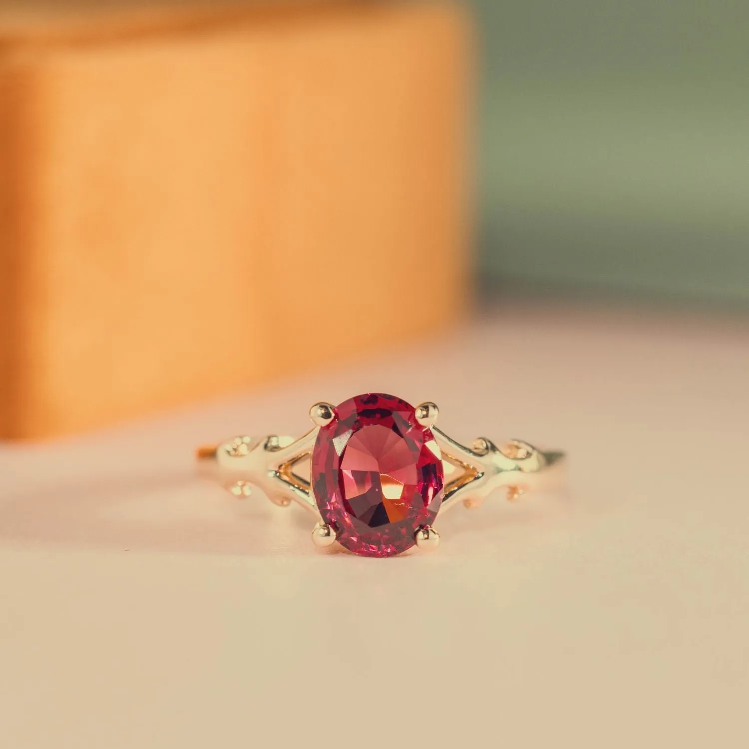 The Dakota - Oval Garnet Rhodolite Solitaire Engagement Ring with Nature-Inspired Split Shank Setting